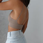 Side back view of grey seamless camisole support bra with thin strap comfort