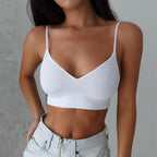 White seamless camisole support bra with soft stretch fabric and wireless support