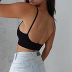 Side back view of black seamless camisole support bra with comfortable thin straps