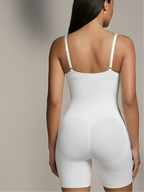 Back view of white sling one-piece shapewear bodysuit with smooth support and shaping fit