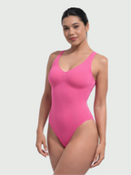 Angled front view of pink bust support bodysuit with smooth sculpting support