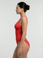 Side view of red bust support bodysuit with smooth shaping and tummy control