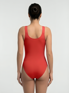 Back view of red bust support bodysuit with seamless body-contouring support