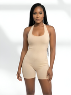 Beige sculpting romper shaper for women with seamless tummy control and smooth fit
