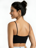 Back view of black seamless camisole support bra with thin straps and smooth fit