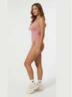 Side view of pink seamless shaping bodysuit with comfortable tummy control