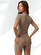 Back view of bronze short sleeve yoga set with smooth fitted activewear design