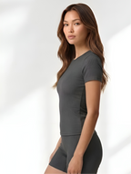 Side view of grey yoga wear set with soft stretch fabric and body-hugging fit