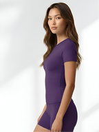 Side view of purple short sleeve yoga set for gym, yoga, and everyday wear