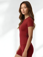 Side view of red yoga wear set with soft stretch fabric and comfortable fit