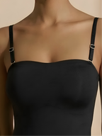 Close-up of black strapless thong shaper with removable straps and seamless bust support
