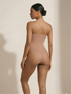 Back angled view of nude strapless thong shaper with smooth waist and hip shaping