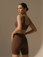 Back angled view of brown bra and pant set with seamless activewear fit