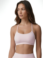 Pink women’s sports bra with soft support and comfortable stretch fit