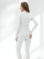 Back view of white yoga wear set with sculpting leggings and zip-up jacket