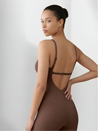 Back view of brown backless shorts bodysuit with crisscross straps and seamless shaping