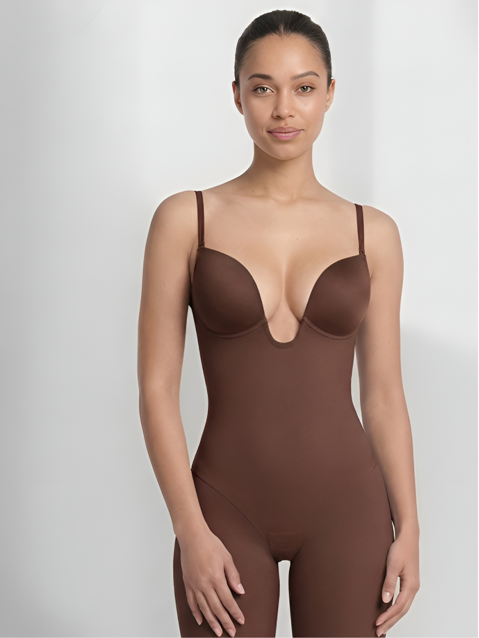 Front view of brown backless shorts bodysuit with smooth body contouring