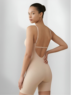 Angled back view of tan backless shorts bodysuit with open back and sculpting support
