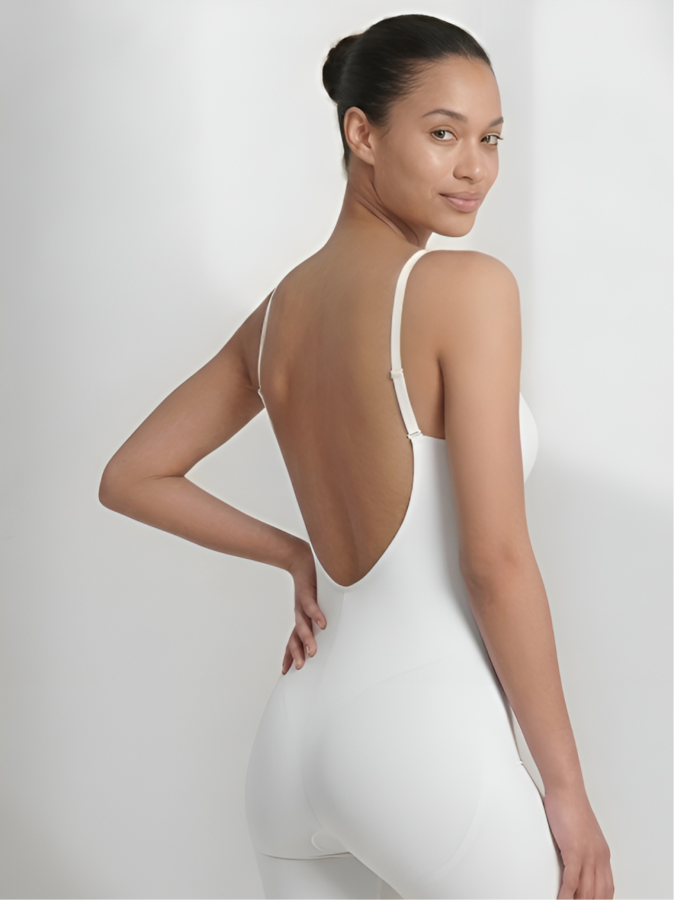 White backless shorts bodysuit for women with deep plunge front and slimming support