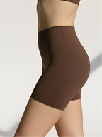 Side view of brown anti-chafing shapewear shorts with smooth seamless fit