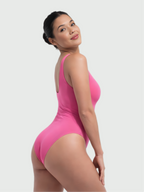 Side view of pink bust support bodysuit with body-contouring and shaping fit